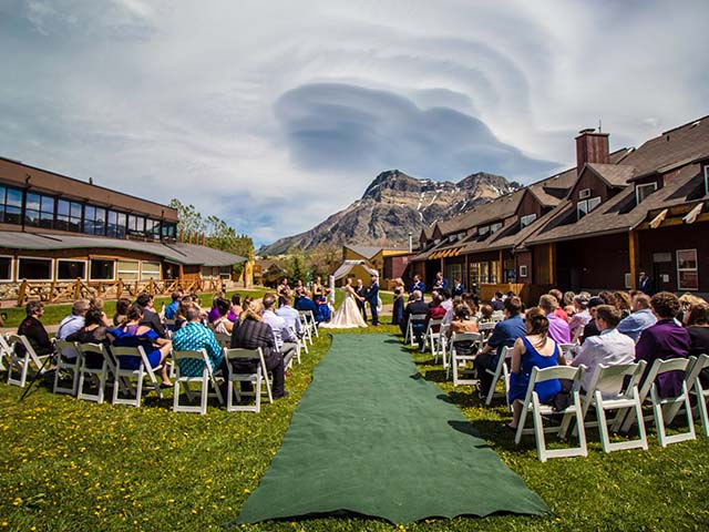 A large summer taking place in the Beargrass Field with a mountain backdrop.